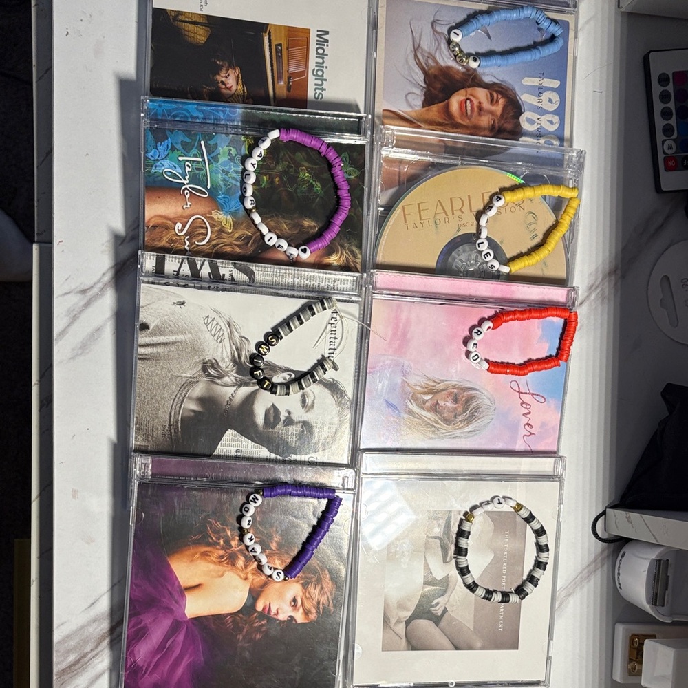 Taylor swift cd’s with matching bracelets!